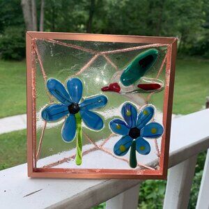 #6341 FUSED GLASS SUN CATCHER  BLUE FLOWERS & HUMMING BIRD GOLD TONE FRAME
